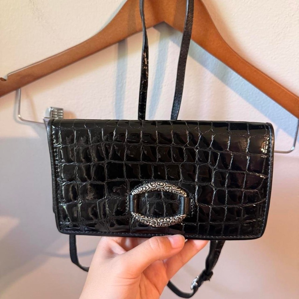 Brighton black textured leather wallet with silver buckle and crossbody strap